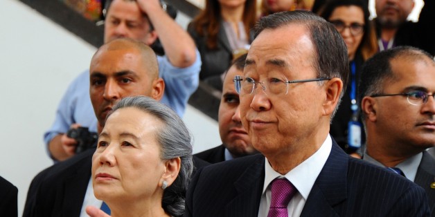 UN chief Ban Ki-moon and his wife Yoo Soon-taek, left, visit the Bardo museum as they pay respect to the victims killed in the March 2015 attack on the Bardo museum during a ceremony held in Tunis, Tunisia, Monday, March 28, 2016 .(AP Photo/Hassene Dridi)