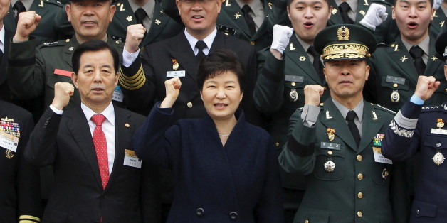 GYERYONG, SOUTH KOREA - MARCH 04: South Korean President Park Geun-Hye cheers with new military officers during a military commissioning ceremony at Gyeryongdae, South Korea's main military compound on March 4, 2016 in Gyeryong, South Korea. Total 6003 graduates from the country's six major military academies were commissioned at the ceremony. REUTERS/Chung Sung-Jun/Pool