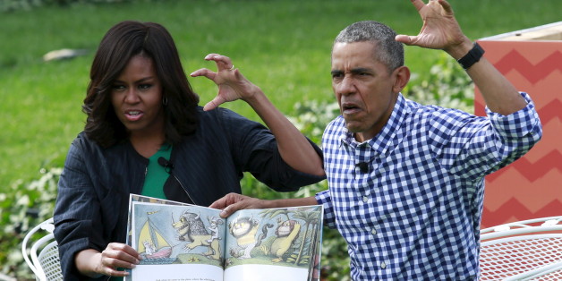 U.S. President Barack Obama and first lady Michelle Obama perform a reading of the children's book "Where the Wild Things Are" for children gathered for the annual White House Easter Egg Roll on the South Lawn of the White House in Washington, March 28, 2016. REUTERS/Yuri Gripas TPX IMAGES OF THE DAY