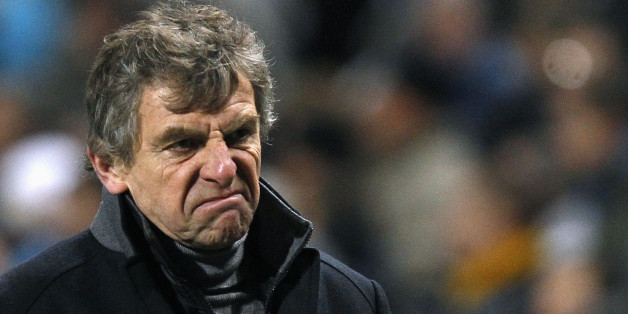Lorient's head coach Christian Gourcuff reacts on the pitch at half-time during his French Ligue 1 soccer match against Olympique Marseille at the Velodrome stadium in Marseille, December 17, 2011. REUTERS/Jean-Paul Pelissier (FRANCE - Tags: SPORT SOCCER)