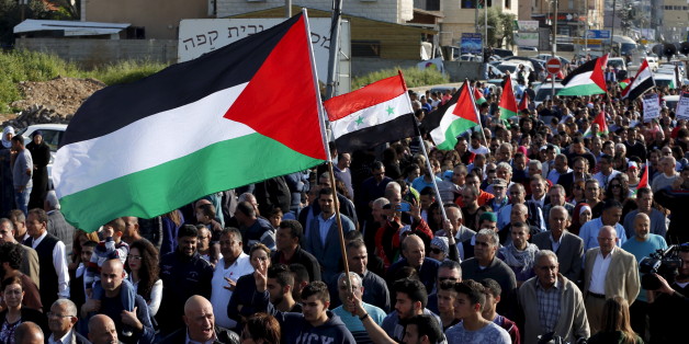 Israeli Arab demonstrators take part in a Land Day rally in the northern Israeli village of Arrabe March 30, 2016. Land Day commemorates the killing of six Arab citizens of Israel by security forces during protests in 1976 over government land confiscations. REUTERS/Ammar Awad