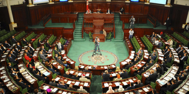 Tunisian parliament members gather during the inaugural session of the newly elected Tunisian parliament in Tunis, Tuesday, Dec. 2, 2014. This is the first national assembly meeting since the October 2014 legislative elections that resulted in a victory for opposition secular parties. (AP Photo/Hassene Dridi)