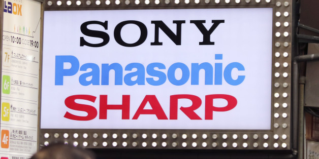 The brands' names of Japanese electronics makers, including Sharp, are displayed on a signboard of a retailer at Akihibara shopping district in Tokyo, Saturday, April 2, 2016. The head of Foxconn says the Taiwanese contract manufacturer will turn around struggling Japanese electronics maker Sharp. The leaders of the two companies met Saturday in Japan to sign agreements for Foxconn to buy a 66 percent share in the 104-year-old Japanese firm. (AP Photo/Shuji Kajiyama)