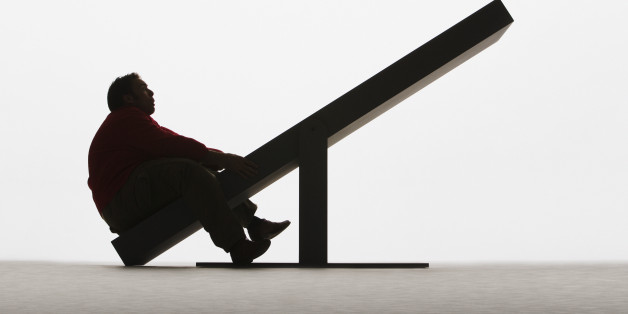 Large man on unbalanced plank