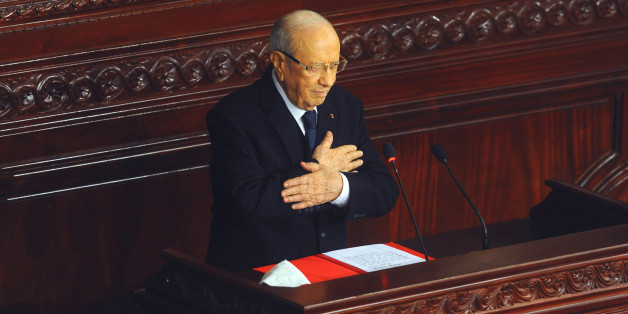 Beji Caid Essebsi, acknowledges the applauses after swearing in as new Tunisian President during a ceremony at the National Assembly in Tunis, Tunisia, Wednesday, Dec. 31, 2014. Tunisia's new president pledged a rule of reconciliation and consensus as he took his oath Wednesday before the newly elected parliament to complete the country's democratic transition. The inauguration of Beji Caid Essebsi, an 88-year-old political veteran, comes in a year in which Tunisians wrote a new constitution and elected a new parliament and president, ending a transition kicked off by a revolution. (AP Photo/Hassene Dridi)