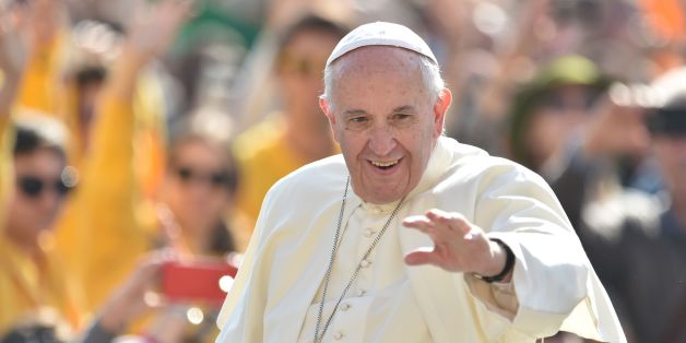 Pope Francis greets the crowd as he arrives for his weekly general audience at St Peter's square on March 30, 2016 at the Vatican. AFP PHOTO / TIZIANA FABI / AFP / TIZIANA FABI (Photo credit should read TIZIANA FABI/AFP/Getty Images)