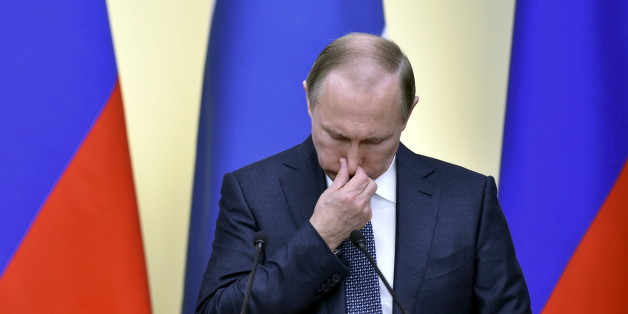 Russian President Vladimir Putin wipes his nose during a joint news conference with his Finnish counterpart Sauli Niinisto following their talks at the Novo-Ogaryovo state residence outside Moscow, Russia, March 22, 2016. REUTERS/Kirill Kudryavtsev/Pool