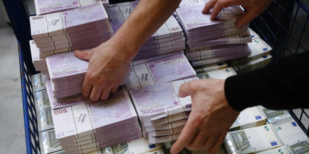 Wads of euro banknotes are stacked in a pile at the Money Service Austria company's headquarters in Vienna, Austria, March 3, 2016. REUTERS/Leonhard Foeger