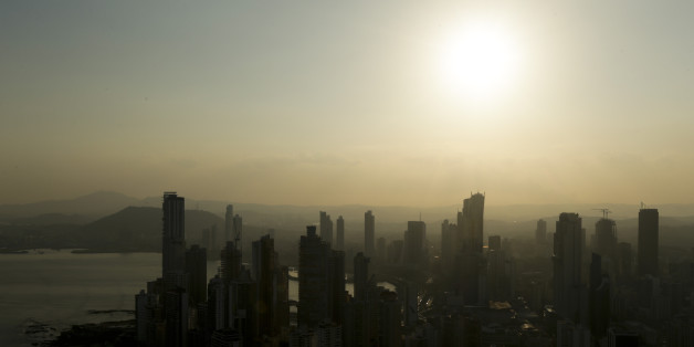 Panama City skyline is silhouette at sunset in Panama, Monday, April 4, 2016. Panama's president says his government will cooperate "vigorously" with any judicial investigation arising from the leak of a vast trove of information on the offshore financial dealings of the world's rich and famous. An international coalition of media outlets Sunday published investigations it said stemmed from the leak of 115 million records kept by the Panama-based law firm Mossack Fonseca on behalf of clients. (AP Photo/Arnulfo Franco)