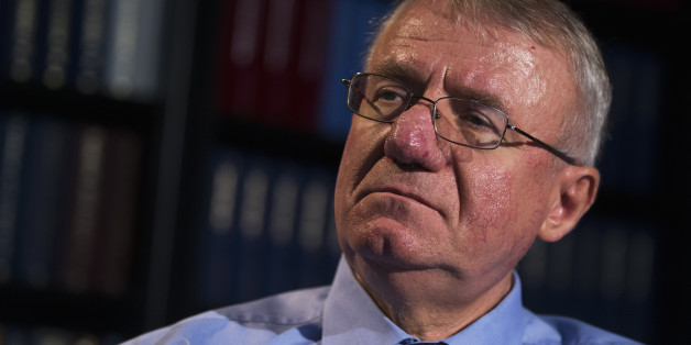 Serbian nationalist leader Vojislav Seselj looks on during an interview with Reuters inside his Serbian Radical Party headquarters in Belgrade, December 2, 2014. Prosecutors at a United Nations war crimes court urged judges on Monday to order the return of a hardline Serb nationalist defendant freed last month on grounds of ill-health, only to throw himself back into Serbian politics. REUTERS/Marko Djurica (SERBIA - Tags: POLITICS CRIME LAW)