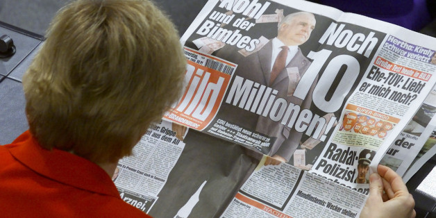 An unidentified Christian Democratic (CDU) member of the Bundestag lower house of parliament reads the front page of Germany's biggest daily newspaper "Bild" ahead of a parliamentary debate in the Reichstag in Berlin January 20. The headline in "Bild" reads "Kohl and the cash. Another ten million". Wolfgang Schaeuble, leader of Germany's scandal-stricken oppostion CDU apologised to parliament for misleading the chamber over a cash donation he accepted from a fugitive arms leader.
WR