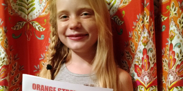 In this September 2015, photo provided by Matthew Lysiak, Hilde Kate Lysiak poses for a photo at her home in Selinsgrove, Pa. Lysiak, a 9-year-old reporter, recently wrote about a suspected murder in her small Pennsylvania town and is defending herself after some locals lashed out about a young girl covering violent crime. (Isabel Rose Lysiak via AP)