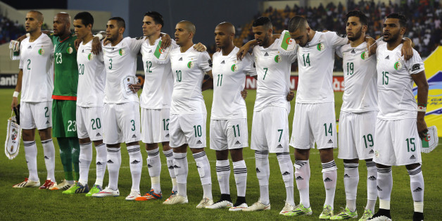 Algeria's national soccer team players listen to their national anthem before their quarter-final soccer match of the 2015 African Cup of Nations against Ivory Coast in Malabo February 1, 2015. REUTERS/Amr Abdallah Dalsh (EQUATORIAL GUINEA - Tags: SPORT SOCCER)