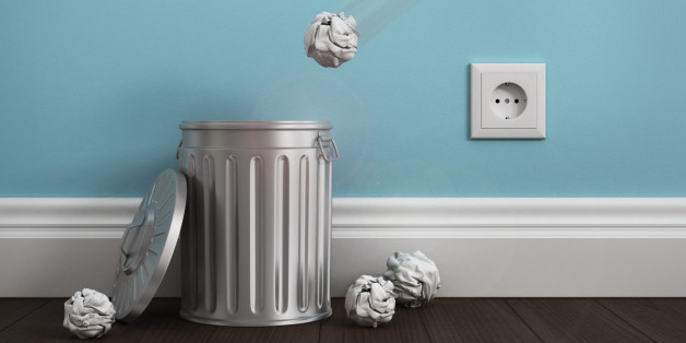 office garbage near metal basket