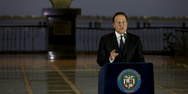 With a bust of Latin America's independence hero Simon Bolivar in the background, Panama's President Juan Carlos Varela gives a televised statement to the nation, in Panama City, Wednesday, April 6, 2016. Varela spoke about the millions of confidential documents that were leaked from a Panama-based law firm, coined the "panama papers," revealing details of how some of the globe's richest people funnel their assets into secretive shell companies set up in Panama and in other lightly regulated jur