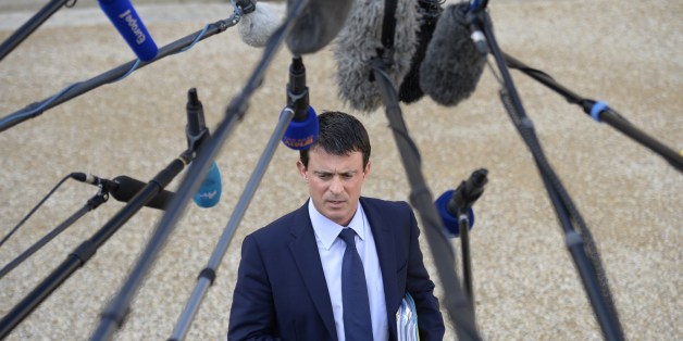 French Interior Minister Manuel Valls speaks to the press as he leaves the Elysee Palace in Paris, on October 23, 2013, after the weekly cabinet meeting. AFP PHOTO MARTIN BUREAU (Photo credit should read MARTIN BUREAU/AFP/Getty Images)