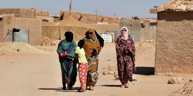 Sahrawi womenwalk through the Smara refugee camp near Tindouf, south-western Algeria, Friday, March 4, 2016. U.N. chief Ban Ki-moon is expected to arrive in Tindouf on March 5 to visit Sahrawi refugee camps. Ban Ki-moon will meet with leaders of the Polisario Front, the organization disputing sovereignty over Western Sahara with Morocco, in the hope to help solving a 40-year conflict. (AP Photo/Toukik Doudou).