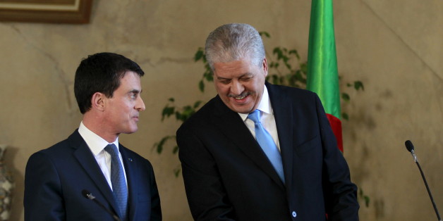French Prime Minister Manuel Valls (L) speaks to Algerian Prime Minister Abdelmalek Sellal during a news conference at the government palace in Algiers, April 10, 2016. REUTERS/Ramzi Boudina