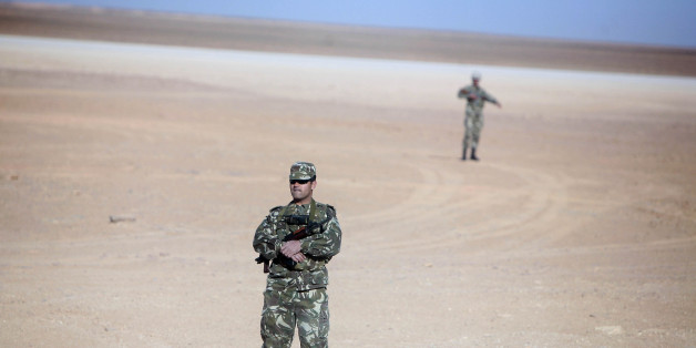 Soldiers stand guard at Krechba gas treatment plant, about 1200 km (746 miles) south of Algiers December 14, 2008. Algeria has approved or plans to approve projects expected to bring on up to 110,000 barrels per day (bpd) of crude oil output and 100,000 bpd of oil equivalents by 2012 or 2013, a Sonatrach official said on Sunday. REUTERS/Zohra Bensemra (ALGERIA)