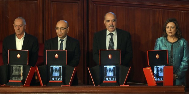 The 2015 Nobel Peace Prize laureates of the Tunisian National Dialogue Quartet (RtoL) the President of the Tunisian employers union (UTICA) Wided Bouchamaoui, the President of the Tunisian Human Rights League (LTDH) Abdessatar Ben Moussa, the President of the National Order of Tunisian Lawyers Fadhel Mahfouz, the Secretary General of the Tunisian General Labour Union Houcine Abbassi pose on February 16, 2016 in Tunis during a session at the Assembly of People's Representatives (ARP). / AFP / FE