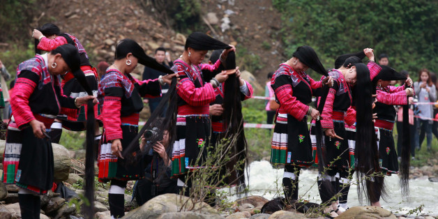 GUILIN, CHINA - APRIL 09: (CHINA OUT) Yao women comb hair during the Long Hair Festival at Longji Huangluo Yao Village on April 9, 2016 in Guilin, Guangxi Zhuang Autonomous Region of China. Yao people celebrated the first Long Hair Festival during the Double Third Festival on March 3 of the Chinese calendar. (Photo by VCG/VCG via Getty Images)