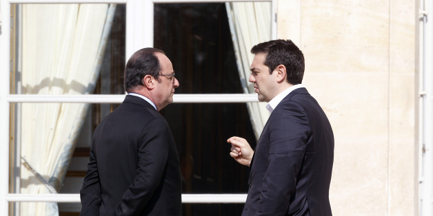 PARIS, FRANCE - MARCH 12: French President Francois Hollande speaks with Greek Prime minister, Alexis Tsipras after a family photo at the Elysee Presidential Palace on March 12, 2016 in Paris, France. Francois Hollande met the European social democratic leaders on the future of the European Union. (Photo by Chesnot/Getty Images)