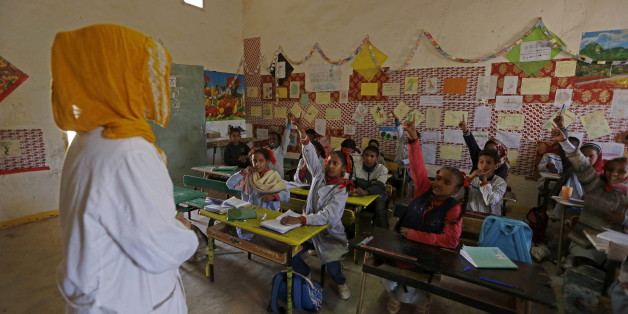 An indigenous Sahrawi teacher attends teaches at a school in Boudjdour desert refugee camp in Tindouf, southern Algeria March 3, 2016. In refugee camps near the town of Tindouf in arid southern Algeria, conditions are hard for indigenous Sahrawi residents. Residents use car batteries for electricity at night and depend on humanitarian aid to get by. The five camps near Tindouf are home to an estimated 165,000 Sahrawi refugees from the disputed region of Western Sahara, according to the United Na
