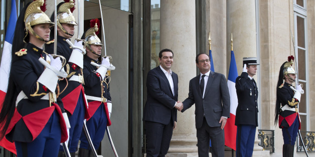 Greek Prime Minister Alexis Tsipras, left, is welcomed by French President Francois Hollande at the Elysee Palace in Paris, France, Wednesday, April 13, 2016. Greek Prime Minister Alexis Tsipras meets French President Francois Hollande after talks between Greece and its bailout creditors over the country's next economic reforms efforts. (AP Photo/Michel Euler)