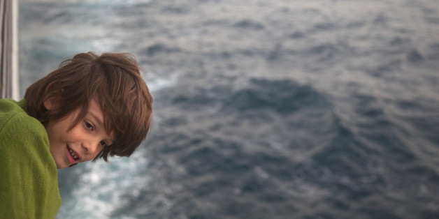 child portrait (10 years) on the deck of a boat