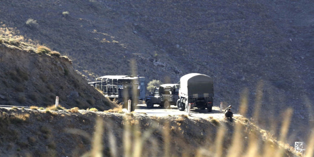 Algerian military troops are pictured at a mountain near the village of Ait Ouabane, where a Frenchman was kidnapped by militants on Sunday, southeast of Algiers September 23, 2014. Algerian military and police set up checkpoints and sent troops into mountains east of Algiers on Tuesday to look for the Frenchman kidnapped by militants who threatened to execute him over France's intervention in Iraq. The Caliphate Soldiers, a splinter group linked to Islamic State militants in Iraq and Syria, on