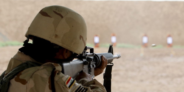 A member from Iraqi security forces takes part during a training session by coalition forces at Taji military base north of Baghdad April 11, 2016. REUTERS/Khalid al Mousily