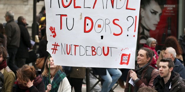 French labour union workers and students attend a demonstration against the labour law proposal in Paris, France, April 9, 2016. The banner reads "Hollande, are you sleeping?", "Nuit Debout" (Rise up at Night). REUTERS/Charles Platiau