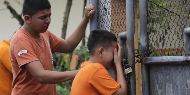 A boy cries as he finds out that their sister was killed in an earthquake in Pedernales, Ecuador, Sunday, April 17, 2016. The strongest earthquake to hit Ecuador in decades flattened buildings and buckled highways along its Pacific coast, sending the Andean nation into a state of emergency. (AP Photo/Dolores Ochoa)