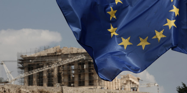 A European Union (EU) flag flutters in front of the temple of the Parthenon in Athens, Greece, Saturday, Aug. 15, 2015. Finance ministers of the 19-nation euro single currency group on Friday approved the first 26 billion euros ($29 billion) of a vast new bailout package to help rebuild Greece's shattered economy. (AP Photo/Yorgos Karahalis)