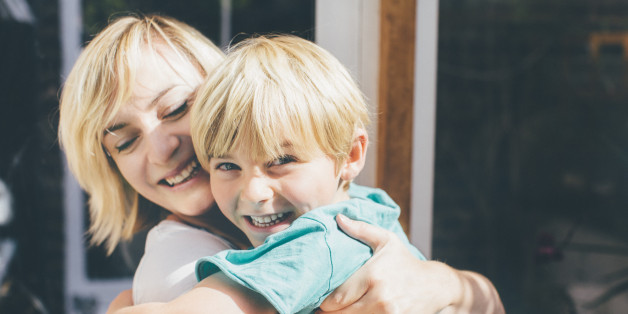 Mother and son hugging