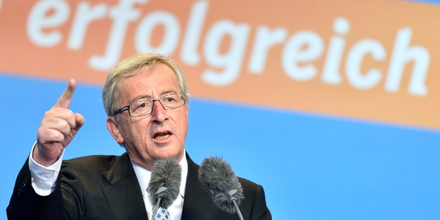The Christian Democratic frontrunner Jean-Claude Junker speaks during an election campaign event for the European election on 25 May 2014 in Worms, Germany, 24 May 2014. Letters in background read "successful". (AP Photo/dpa,Uwe Anspach)