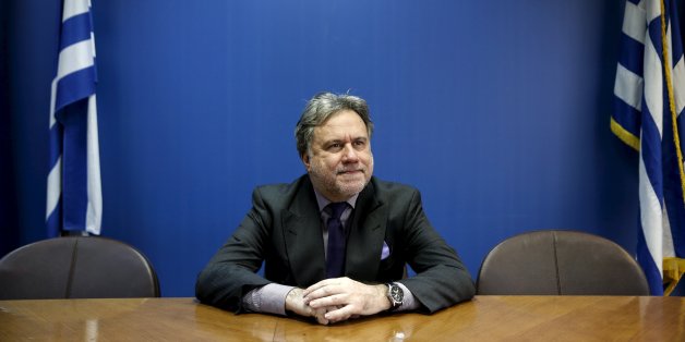 Greek Labour Minister George Katrougalos poses for a picture before an interview with Reuters at his office at the ministry in Athens, Greece, February 24, 2016. Greece's left-led government will not cut pensions again even if its international lenders demand it, the country's labour minister told Reuters on Thursday, saying the income of the weak will be protected. REUTERS/Alkis Konstantinidis