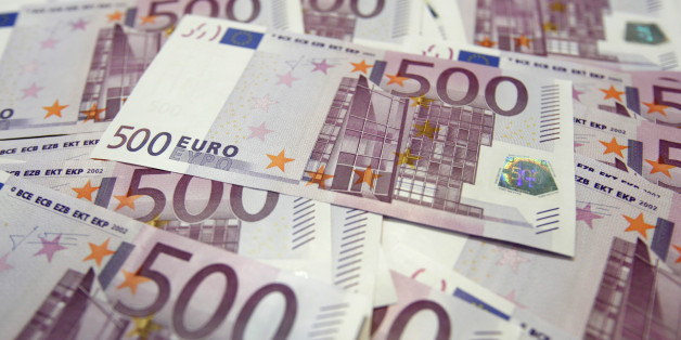 Euro notes are pictured at a bank in this photo illustration taken in Seoul June 18, 2012. South Korean shares rallied across-the-board on Monday on relief that a weekend election in Greece resulted in a pro-bailout parliamentary majority, averting likely financial turmoil had parties opposed to a bailout won the vote. REUTERS/Lee Jae-Won (SOUTH KOREA - Tags: BUSINESS)