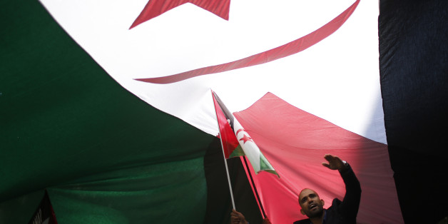 A man takes part in a demonstration in support of Western Sahara's independence, in Madrid November 16, 2014. Thirty-nine years after Spain left Western Sahara in the hands of Moroccan troops, two thirds of its territory still remain under the rule of Rabat. The leader of Polisario Front and president of the The Sahrawi Arab Democratic Republic, Mohamed Abdelaziz, demanded the mediation of Spanish authorities in a conflict that started when the former colony was abandoned days before the death of Spanish Dictator Francisco Franco, on November 20, 1975. REUTERS/Juan Medina (SPAIN - Tags: POLITICS CIVIL UNREST TPX IMAGES OF THE DAY)