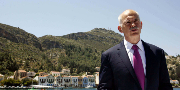 FILE - In this file photo of Friday, April 23, 2010 Greek Prime Minister George Papandreou announces Greece's decision to request activation of a joint eurozone-International Monetary Fund financial rescue plan, from the main port of the remote southeast Greek Aegean island of Kastellorizo. It's an anniversary few are celebrating. A year ago Saturday, with its faltering economy days away from bankruptcy, Greece ended months of speculation and requested bailout loans. Papandreou chose the remote island of Kastelorizo, and its tranquil seaside backdrop, to announce the "urgent national need to formally ask our partners to mobilize the support mechanism." (AP Photo/Tatiana Bolari, File)