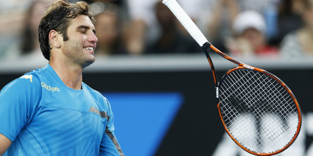 Malek Jaziri of Tunisia throws his racquet during his men's singles third round match against Nick Kyrgios of Australia at the Australian Open 2015 tennis tournament in Melbourne January 23, 2015. REUTERS/Athit Perawongmetha (AUSTRALIA - Tags: SPORT TENNIS)
