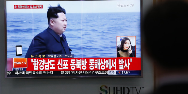 A man watches a TV news program showing a file footage of North Korean leader Kim Jong Un at the Seoul Train Station in Seoul, South Korea, Saturday, April 23, 2016. North Korea on Saturday fired what appeared to be a ballistic missile from a submarine off its northeast coast, South Korean defense officials said, Pyongyang's latest effort to expand its military might in the face of pressure by its neighbors and Washington. The Korean letters read: "North Korea fires submarine-launched ballistic
