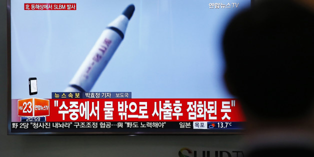 A man watches a TV news program showing a file footage of a missile launch conducted by North Korea, at the Seoul Train Station in Seoul, South Korea, Saturday, April 23, 2016. North Korea on Saturday fired what appeared to be a ballistic missile from a submarine off its northeast coast, South Korean defense officials said, Pyongyang's latest effort to expand its military might in the face of pressure by its neighbors and Washington. The Korean letters at top left read: "North Korea fires a subm