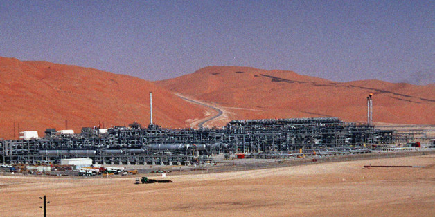 FILE - In this Monday, March 8, 2004 file photo, an industrial plant strips natural gas from freshly pumped crude oil is seen at Saudi Aramco's Shaybah oil field at Shaybah in Saudi Arabia's Rub al-Khali desert. King Salman announced the approval for the "Vision 2030" plan in a short televised announcement on Monday in which he called on Saudis to work together ensure its success. (AP Photo/Bruce Stanley, File)