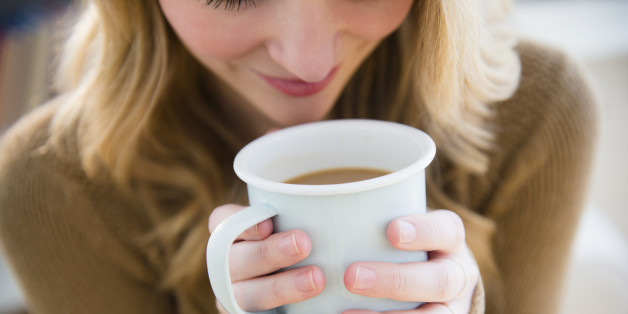 USA, New Jersey, Jersey City, Woman holding coffee mug