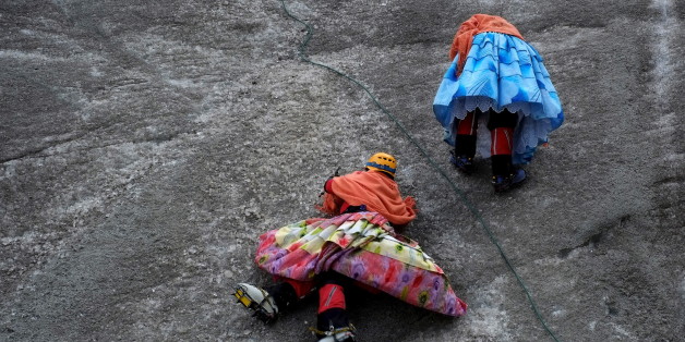 Aymara indigenous women practise on a glacier of the Huayna Potosi mountain on the outskirts of La Paz, Bolivia, April 6, 2016. Two years ago, about a dozen Aymara indigenous women, aged 42 to 50, who worked as porters and cooks for mountaineers at base camps and mountain climbing refuges on the steep, glacial slopes of Huayna Potosi, an Andean peak outside La Paz, Bolivia, put on crampons under their wide traditional skirts and started to do their own climbing. REUTERS/David Mercado SEARCH "CHOLITA CLIMBERS" FOR THIS STORY. SEARCH "THE WIDER IMAGE" FOR ALL STORIES