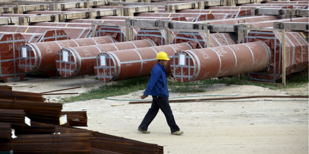 A Chinese worker walks at the construction site of the new Great Mosque, which is being built by the China State Construction Engineering Corporation (CSCEC), in Algiers, Algeria January 20, 2016. Algeria is turning to China for external financing for several infrastructure projects including a new $3.2 billion port as the North African OPEC state looks to weather the collapse in global oil prices. REUTERS/Ramzi Boudina