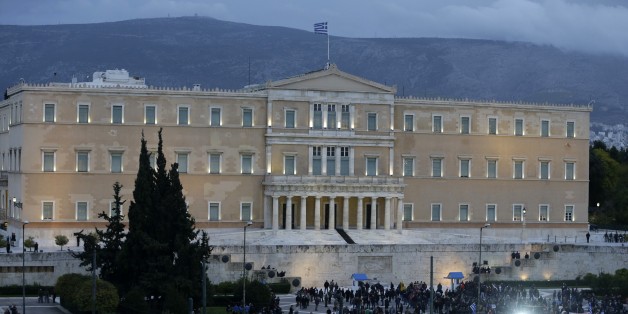 Farmers and other demonstrators gather during a protest in front of the Greek parliament in Athens, Friday, Feb. 12, 2016. Farmers from across Greece gather in Athens for a two-day protest against the government and its plans to impose new tax hikes and pension charges. Bailout lenders are demanding that Greece scrap tax breaks for farmers and impose pension reforms that will lead to higher monthly contributions from the self employed and salaried employees. (AP Photo/Thanassis Stavrakis)