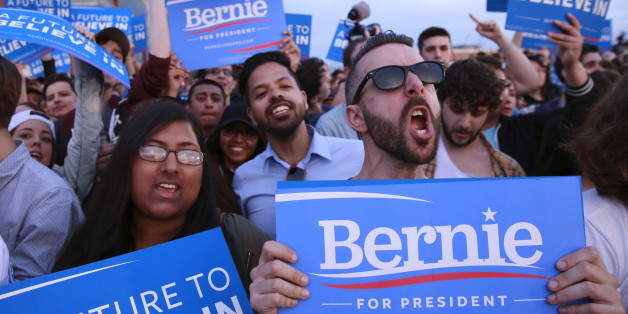 Members of a crowd cheer as they listen to Democratic U.S. presidential candidate Bernie Sanders speak during a campaign rally at Hunter's Point in the Queens borough of New York, U.S., April 18, 2016. REUTERS/Lucas Jackson