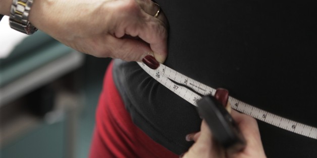 **ADVANCE FOR MONDAY FEB. 1, 2010**In this photo taken Jan. 20, 2010, Paris Woods, has her waist measured as she takes part in her final session of a 20 month obesity prevention study at Rush University Medical Center in Chicago. Like nearly one-third of American teens, Paris is overweight and her doctor worries that she is headed for obesity. Wishing to avoid that scenario, Paris, and her parents participated in weekly sessions with a nutritionist, exercise trainer and physician preaching major lifestyle changes that could keep the 14-year-old from becoming obese. (AP Photo/M. Spencer Green)